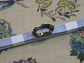 花の丸に蜻蛉小千谷縮名古屋帯と煙水晶帯留