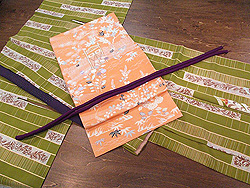 短冊に更紗模様散歩着に間垣の秋庭名古屋帯