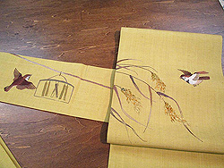 辛子色に稲穂雀の刺繍名古屋帯