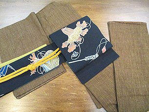 縞結城に宝尽くし筒描き名古屋帯