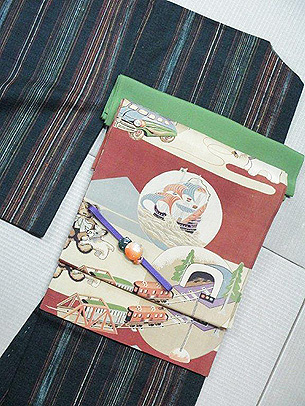 縞紬におもちゃ尽しの帯