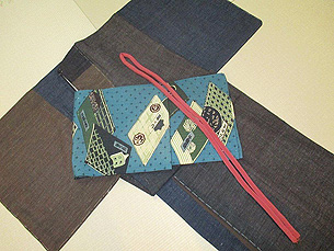 結城縮切継ぎ袷着物に縮緬和本柄開き名古屋帯