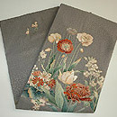 唐草紋綸子地に百花繚乱染帯