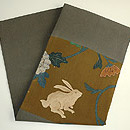 唐花にウサギ縮緬寄裂名古屋帯