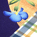 団十郎格子に春の小花の図名古屋帯　質感・風合