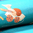 グリーン地おもちゃ尽くし名古屋帯　質感・風合