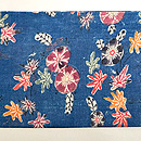 藍木綿地小花文様紅型の名古屋帯　前柄