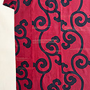 紅殻色唐草文様袷