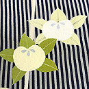 斜線に槍梅と橘の小紋袷