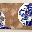 白茶色丸文塩瀬羽二重の名古屋帯　前柄