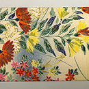 鮮やか色に咲き乱れる花々の染め名古屋帯　前柄