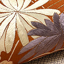 照柿色御簾に菊文様の名古屋帯　質感・風合