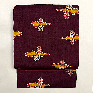 縦節紬雪椿文様の名古屋帯 浦野理一作