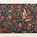 濃い藍地に花や鳥 インドネシア オールドバティック名古屋帯(木綿)　前柄