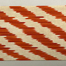 ウズベキスタン アドラス 朱赤斜線文の名古屋帯　前柄