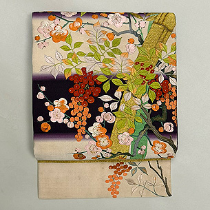 竹梅南天文様綴れに刺繍の名古屋帯