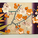 竹梅南天文様綴れに刺繍の名古屋帯 前柄