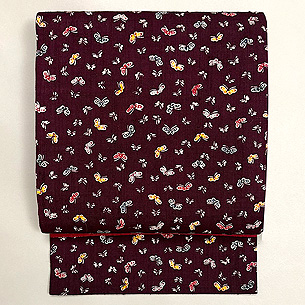 縦節紬小蝶文様の名古屋帯 浦野理一作