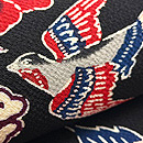 黒地牡丹に燕文鬼縮緬の名古屋帯 浦野理一作 質感・風合