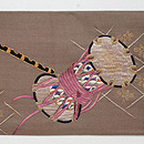 雅楽面の刺繍名古屋帯 前柄