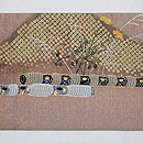 横笛の刺繍名古屋帯 前柄