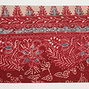 茜染めバティックの名古屋帯　前柄