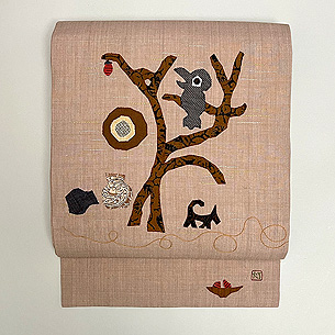 枯れ木にカラスコラージュの名古屋帯